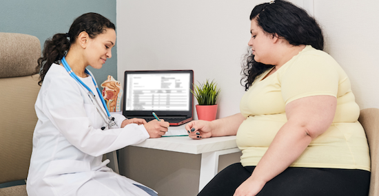 woman being seen at doctors appointment