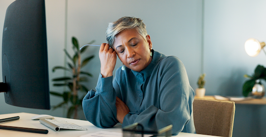 Stressed woman in front of a computer