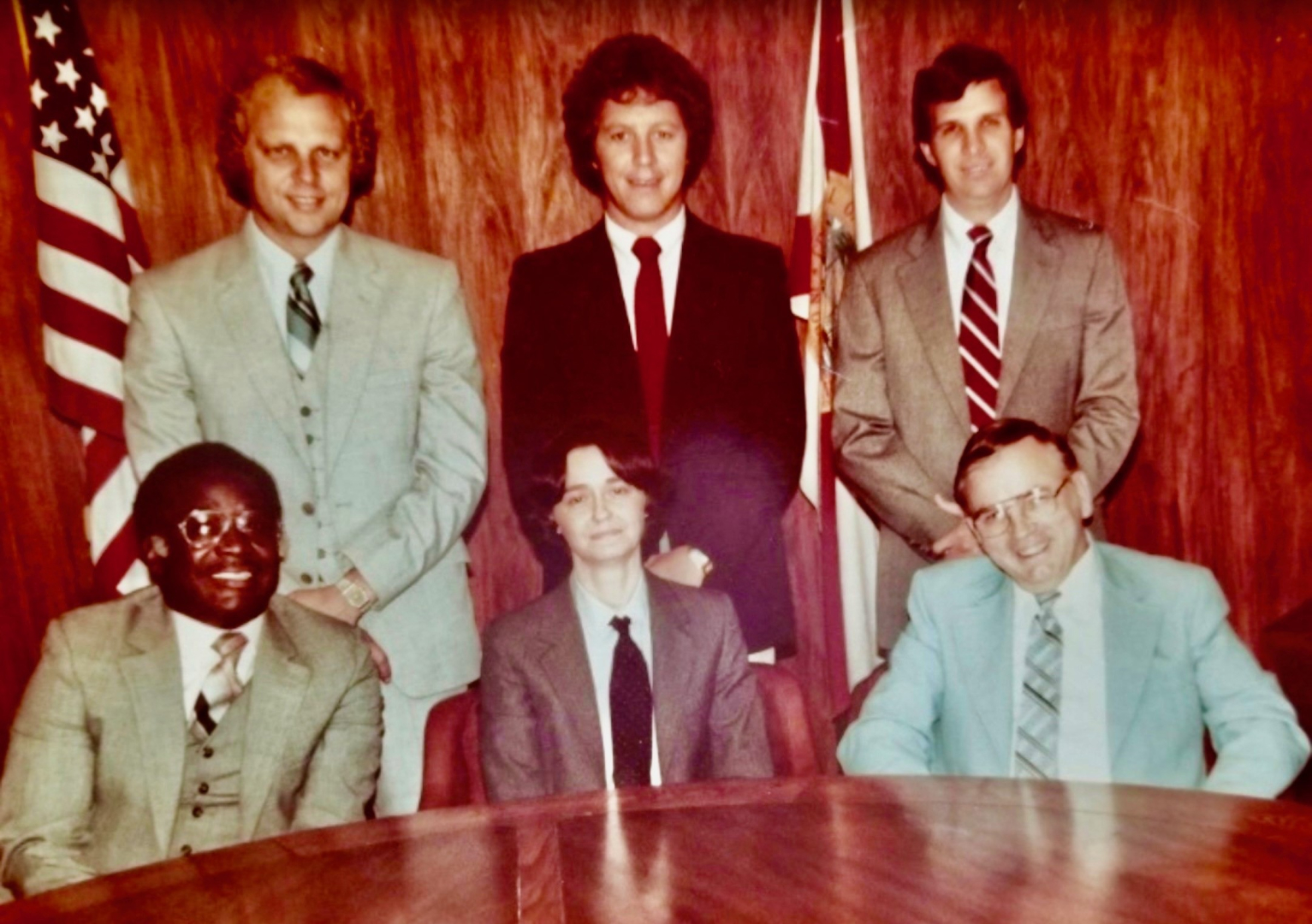 Older photo of a group of 6 men in suits