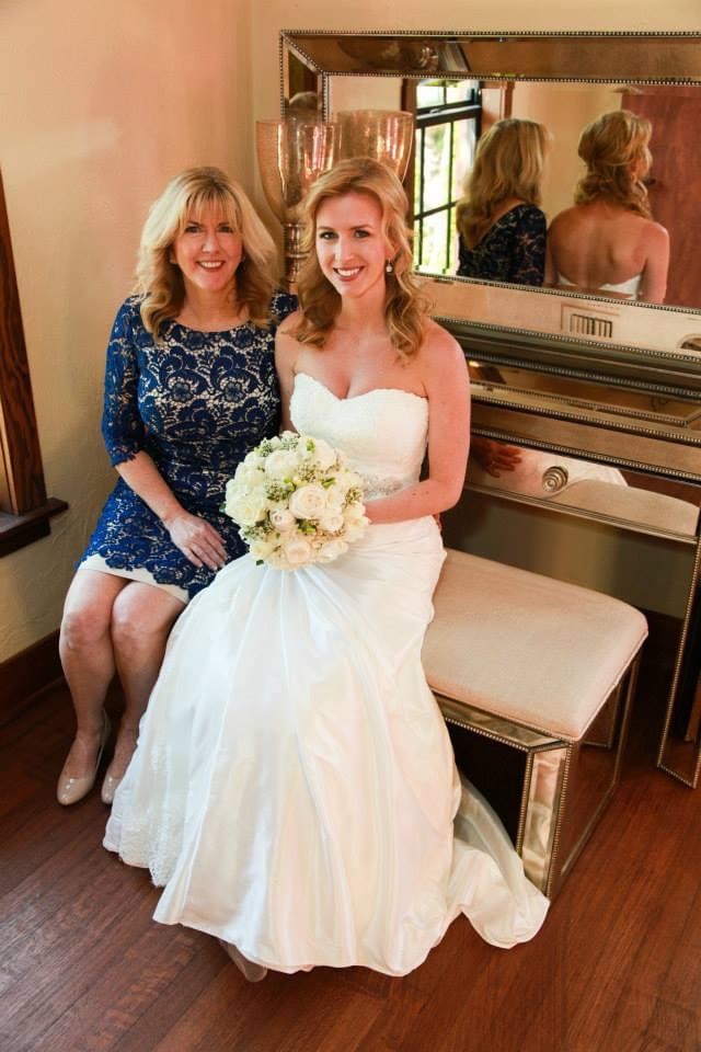 Bride and her mother pose for a photo