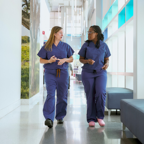 Drs. Blank and Everidge walking through M.T. Mustian Center