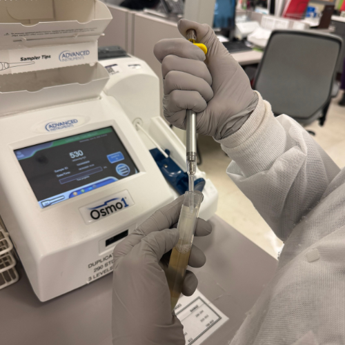Judi taking samples in a tube