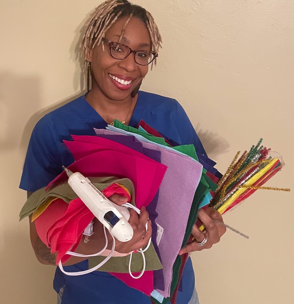 Yamanda holding colorful yarn